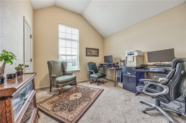 office area with carpet and vaulted ceiling