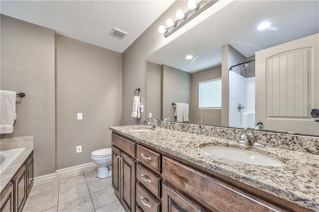 bathroom featuring a sink, baseboards, toilet, and visible vents