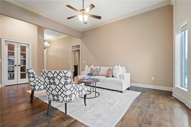 living room featuring crown molding, dark wood-type flooring, and plenty of natural light