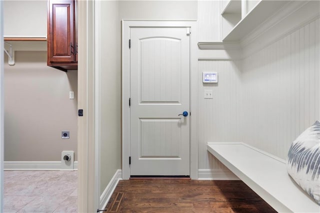 mudroom featuring visible vents, baseboards, and dark wood-type flooring