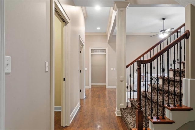 hall with recessed lighting, crown molding, baseboards, ornate columns, and wood finished floors