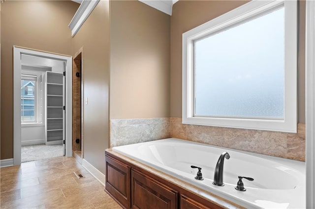 full bath featuring visible vents, a shower stall, and a garden tub