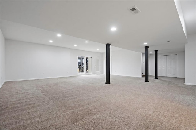 below grade area with baseboards, recessed lighting, visible vents, and light carpet