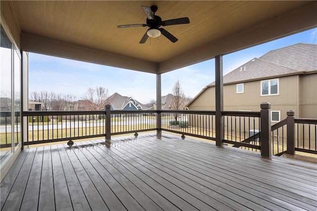 wooden deck with a ceiling fan