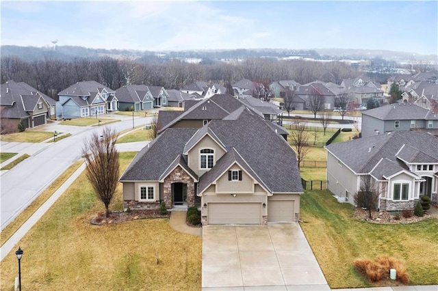birds eye view of property with a residential view