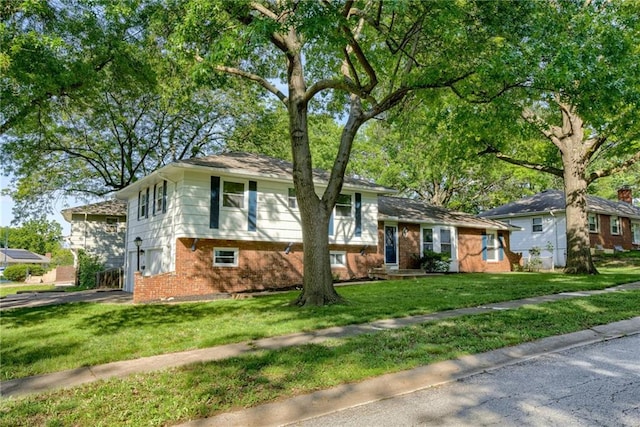 4401 E 104th St, Kansas City, MO 64137 - tri-level home featuring brick siding and a front yard