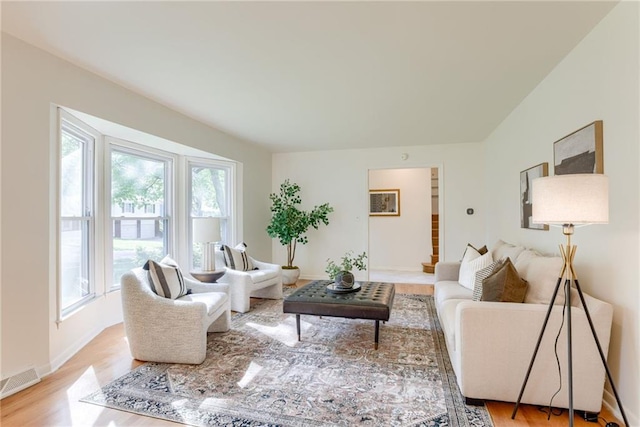 4401 E 104th St, Kansas City, MO 64137 - living area featuring light wood finished floors and baseboards