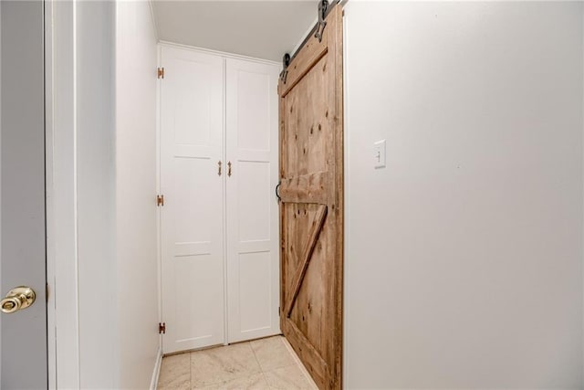4401 E 104th St, Kansas City, MO 64137 - corridor with a barn door and baseboards