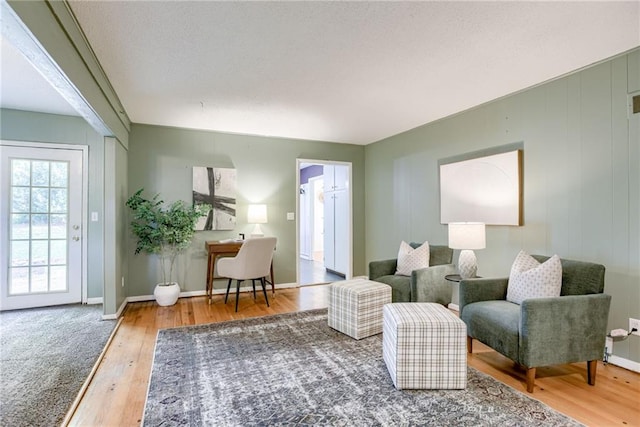 4401 E 104th St, Kansas City, MO 64137 - sitting room featuring wood finished floors and baseboards
