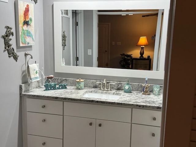 bathroom featuring visible vents and vanity