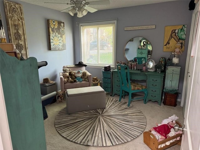 interior space with carpet flooring and a ceiling fan