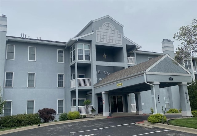 17800 E Bolger Rd Unit 245-A, Independence, MO 64055 - view of building exterior with uncovered parking