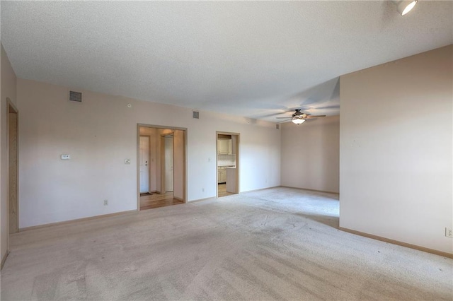 17800 E Bolger Rd Unit 245-A, Independence, MO 64055 - empty room with light colored carpet, a ceiling fan, and baseboards