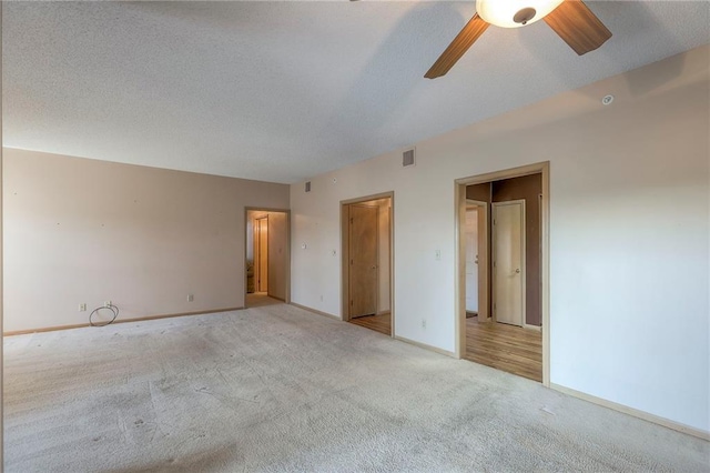 17800 E Bolger Rd Unit 245-A, Independence, MO 64055 - unfurnished bedroom with carpet, baseboards, and a ceiling fan