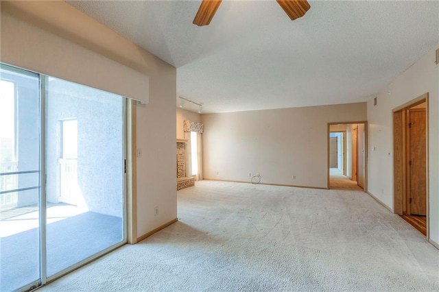 17800 E Bolger Rd Unit 245-A, Independence, MO 64055 - carpeted empty room with ceiling fan, baseboards, and track lighting