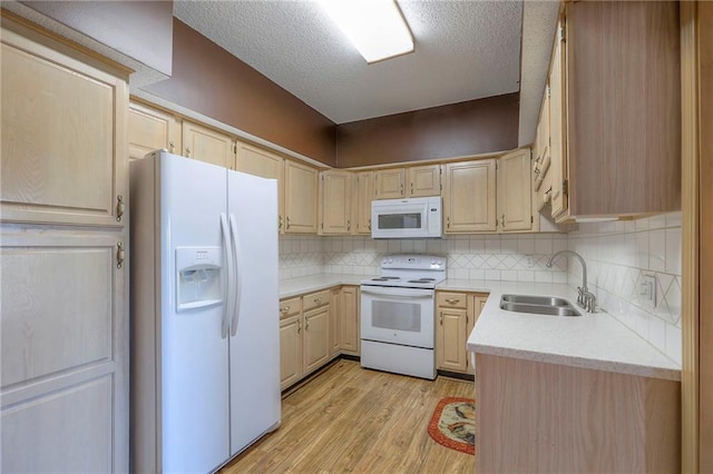 17800 E Bolger Rd Unit 245-A, Independence, MO 64055 - kitchen with white appliances, a sink, light brown cabinets, light wood-type flooring, and light countertops