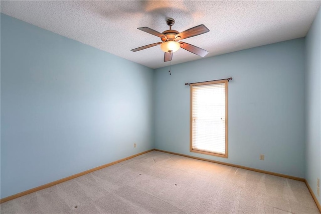 17800 E Bolger Rd Unit 245-A, Independence, MO 64055 - carpeted empty room with baseboards, ceiling fan, and a textured ceiling