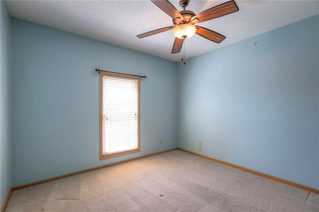 17800 E Bolger Rd Unit 245-A, Independence, MO 64055 - empty room featuring carpet flooring, baseboards, a textured ceiling, and ceiling fan