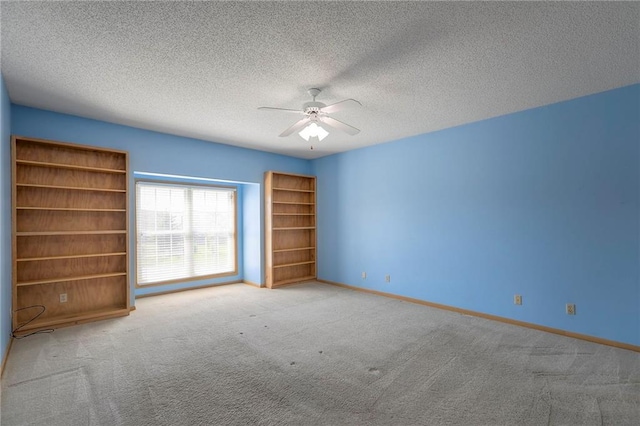 17800 E Bolger Rd Unit 245-A, Independence, MO 64055 - carpeted spare room with ceiling fan, baseboards, and a textured ceiling