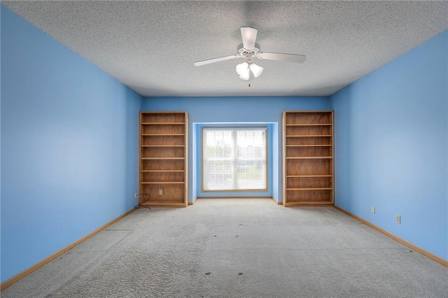 17800 E Bolger Rd Unit 245-A, Independence, MO 64055 - unfurnished room featuring a textured ceiling, carpet, baseboards, and ceiling fan
