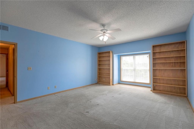 17800 E Bolger Rd Unit 245-A, Independence, MO 64055 - carpeted empty room with a ceiling fan, a textured ceiling, and baseboards