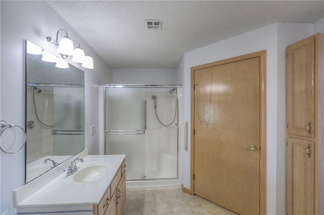 17800 E Bolger Rd Unit 245-A, Independence, MO 64055 - full bathroom featuring a textured ceiling, vanity, and a stall shower