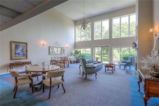 17800 E Bolger Rd Unit 245-A, Independence, MO 64055 - dining space with a high ceiling, carpet, healthy amount of natural light, and a chandelier