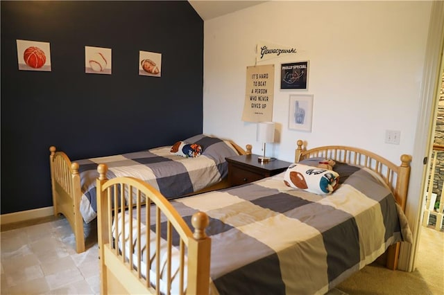 bedroom with lofted ceiling