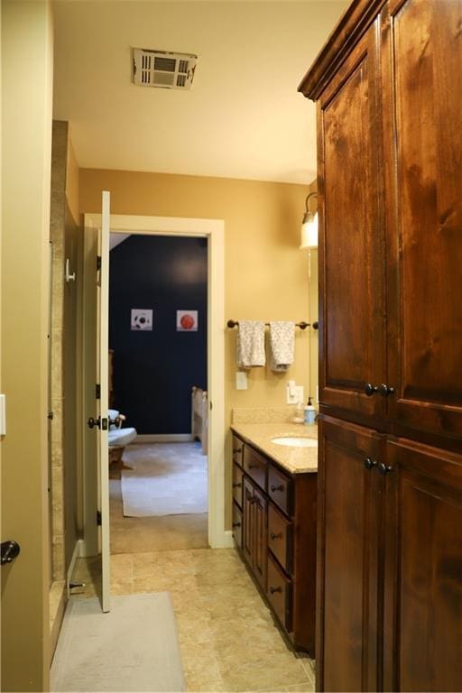 bathroom with vanity and visible vents