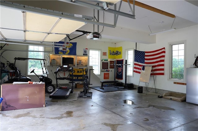 garage with water heater and a garage door opener