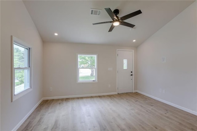 812 S Saville St, Independence, MO 64050 - spare room featuring lofted ceiling, light wood finished floors, a ceiling fan, baseboards, and recessed lighting