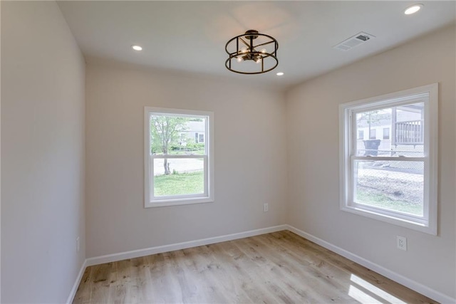 812 S Saville St, Independence, MO 64050 - empty room featuring a chandelier, light wood-style floors, baseboards, and recessed lighting