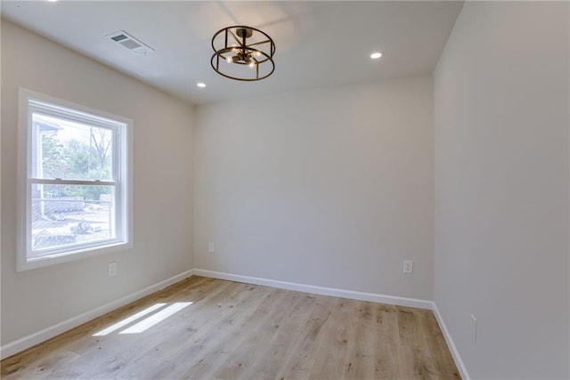 812 S Saville St, Independence, MO 64050 - empty room with a chandelier, light wood finished floors, baseboards, and recessed lighting