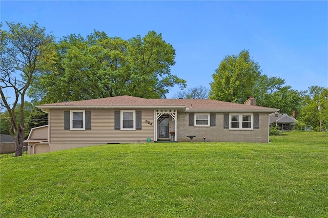 single story home featuring a chimney and a front yard