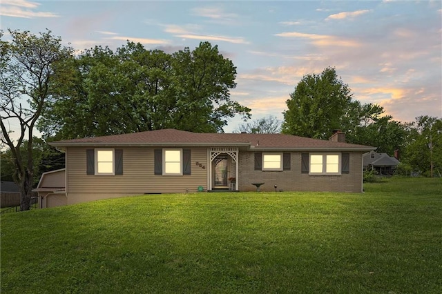 single story home featuring a front lawn and a chimney