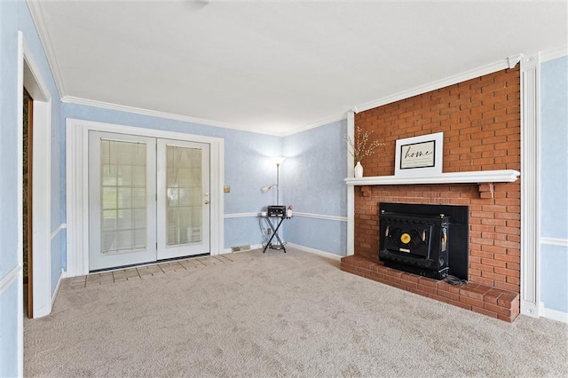 unfurnished living room featuring carpet floors, ornamental molding, and a brick fireplace