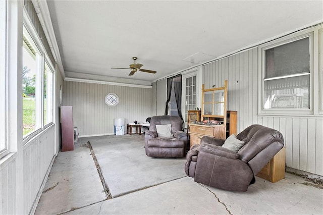 sunroom / solarium with a ceiling fan