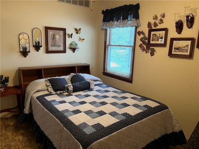 bedroom with carpet floors and visible vents