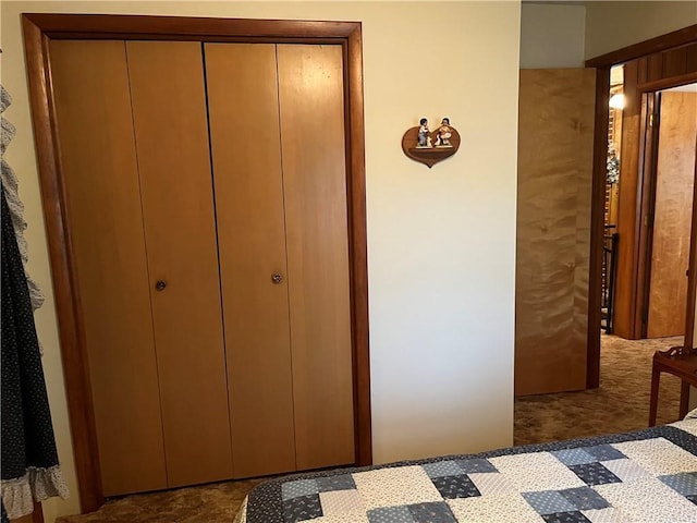 carpeted bedroom featuring a closet