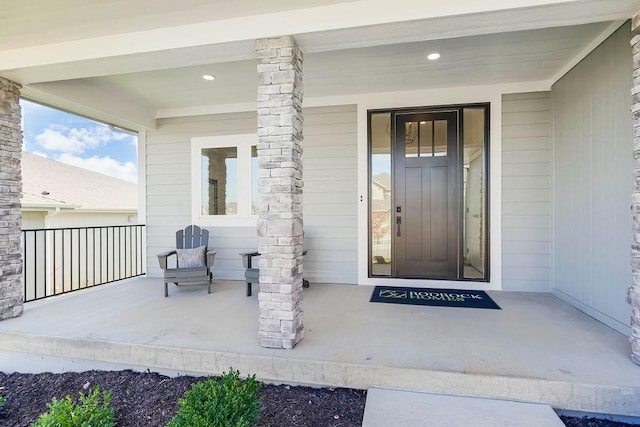 12541 S Hedge Ct, Olathe, KS 66061 - view of exterior entry with a porch