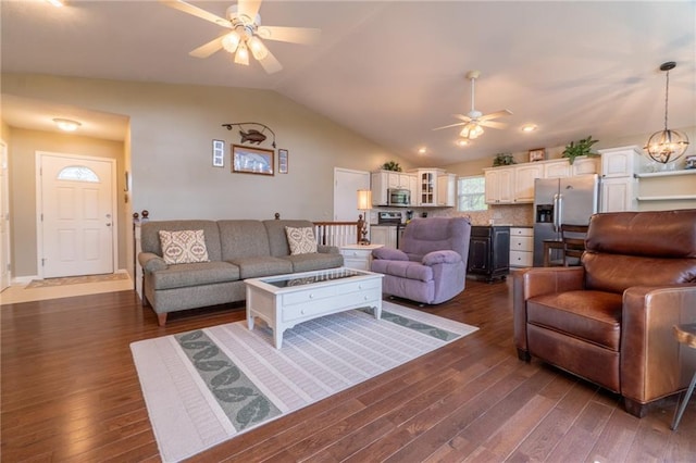 living room featuring ceiling fan, vaulted ceiling, and dark wood-style floors