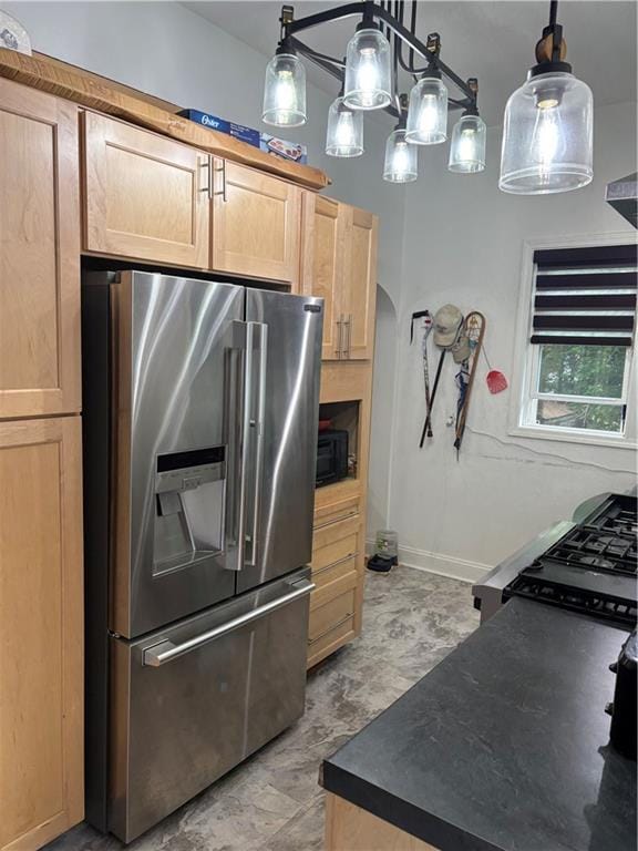1316 Santa Fe St, Atchison, KS 66002 - kitchen with stainless steel refrigerator with ice dispenser, dark countertops, arched walkways, black microwave, and range