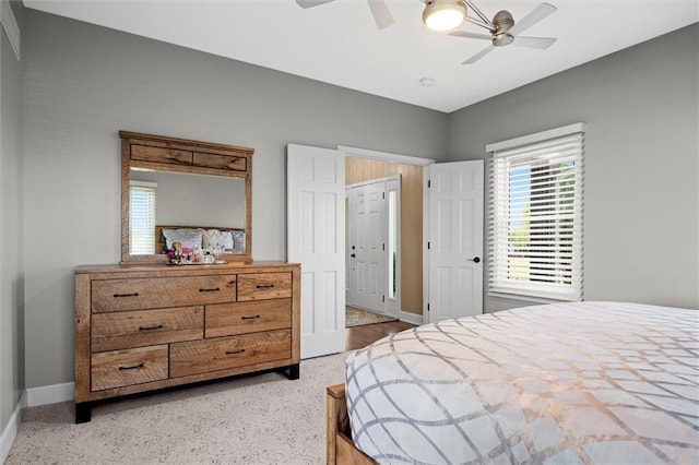 bedroom featuring a ceiling fan and baseboards