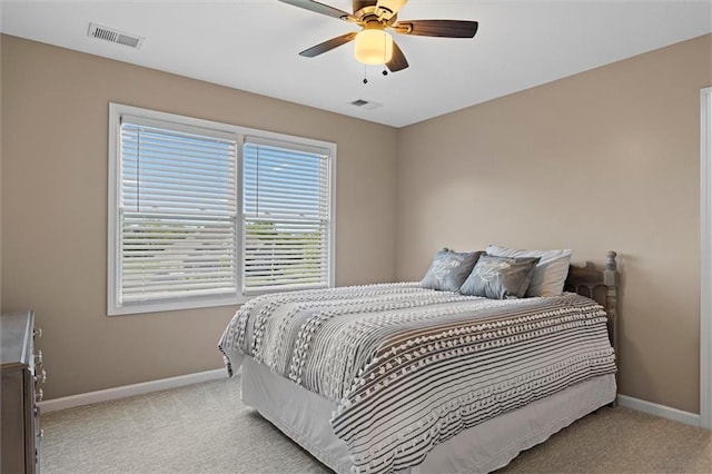 bedroom featuring visible vents, carpet, baseboards, and ceiling fan
