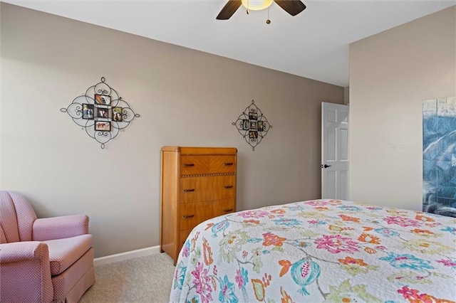 bedroom featuring baseboards, ceiling fan, and carpet