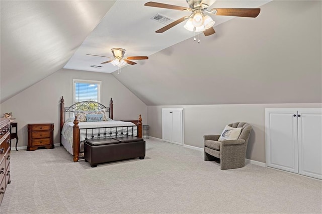 carpeted bedroom with a ceiling fan, baseboards, visible vents, and vaulted ceiling