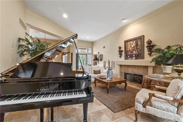 living area with a fireplace, ornamental molding, visible vents, and recessed lighting