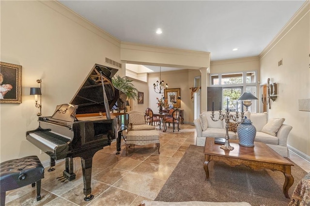 living area featuring visible vents, baseboards, decorative columns, and ornamental molding