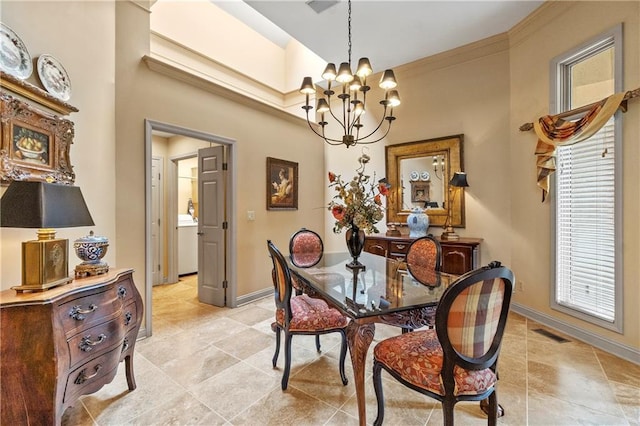 dining area with baseboards, an inviting chandelier, and visible vents