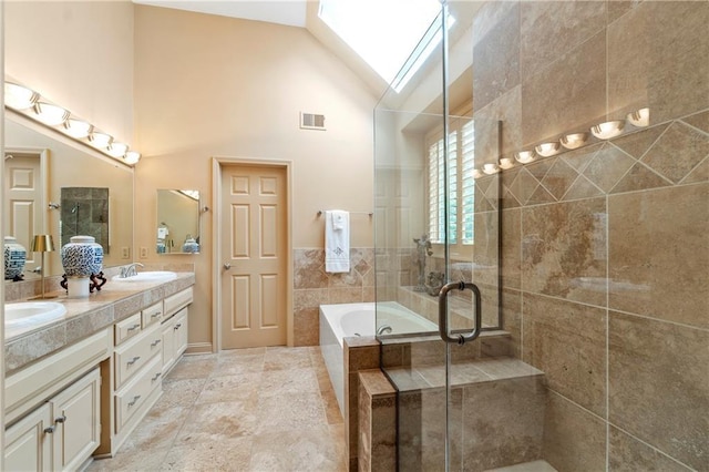 full bathroom with double vanity, a stall shower, high vaulted ceiling, a bath, and visible vents